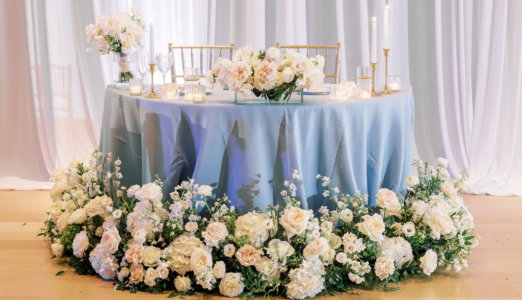 Sweetheart table with white flowers